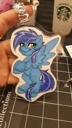 Size: 1152x2048 | Tagged: safe, artist:inkkeystudios, derpibooru import, oc, unofficial characters only, pegasus, pony, badge, image, jpeg, lidded eyes, looking at you, photo, smiling, smug, solo, spread wings, traditional art, unshorn fetlocks, wings