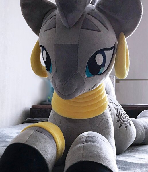 Size: 1762x2048 | Tagged: safe, artist:mdcraft10, derpibooru import, zecora, pony, zebra, ear piercing, earring, female, image, indoors, irl, jewelry, jpeg, lying down, mare, photo, piercing, plushie, prone, solo