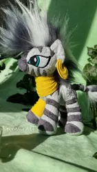 Size: 1080x1920 | Tagged: safe, artist:ferracraft, derpibooru import, zecora, pony, zebra, ear piercing, earring, female, image, irl, ivy (plant), jewelry, jpeg, leaf, mare, neck rings, photo, piercing, plushie, solo