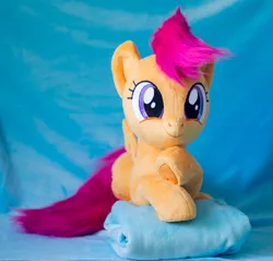 Size: 1441x1375 | Tagged: safe, artist:buttercupbabyppg, derpibooru import, scootaloo, pegasus, pony, female, filly, foal, happy, image, irl, jpeg, lying down, photo, plushie, prone, smiling, solo, spread wings, wings