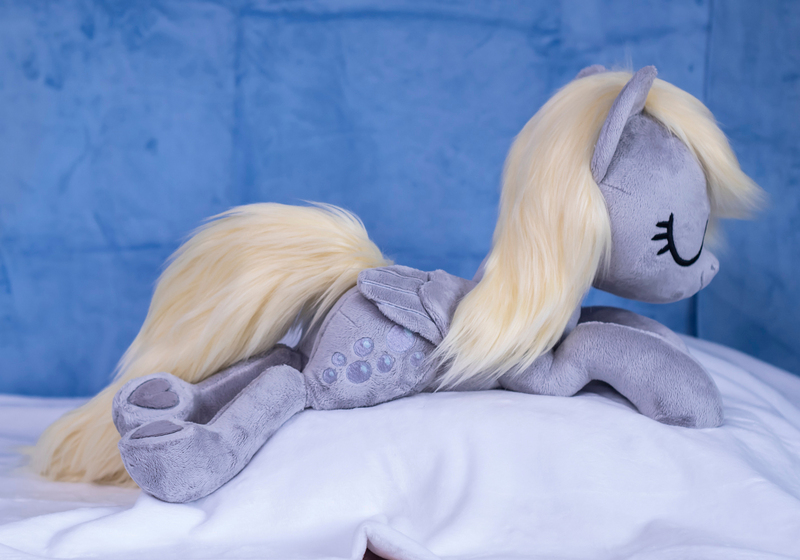 Size: 1415x990 | Tagged: safe, artist:buttercupbabyppg, derpibooru import, derpy hooves, pegasus, pony, eyes closed, female, folded wings, happy, image, irl, jpeg, lying down, mare, photo, plushie, prone, sleeping, wings