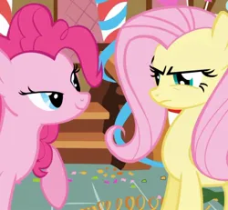 Size: 914x845 | Tagged: safe, derpibooru import, screencap, fluttershy, pinkie pie, earth pony, pegasus, pony, griffon the brush off, season 1, angry, cropped, duo, duo female, female, fluttershy is not amused, frown, image, jpeg, lidded eyes, mare, out of context, smiling, unamused