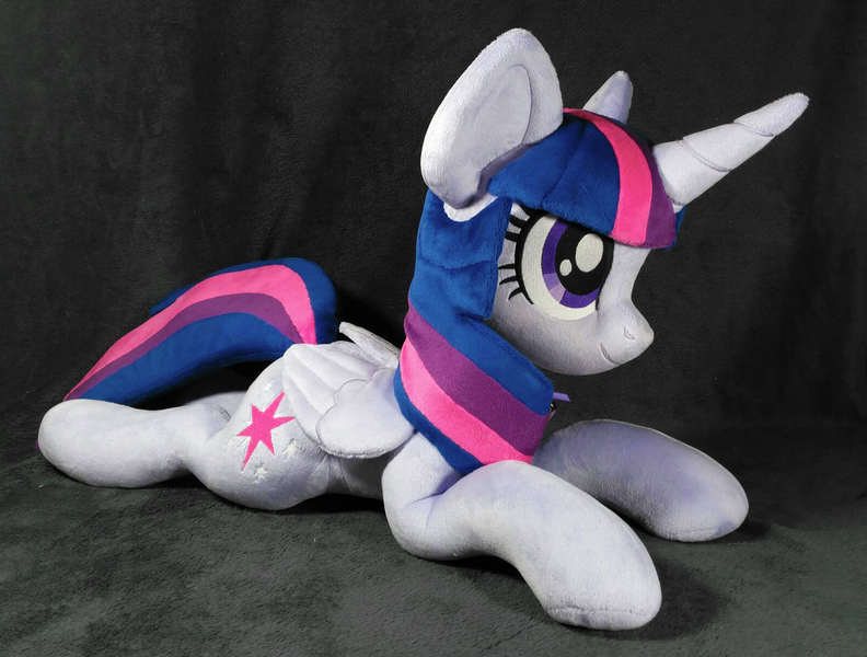 Size: 1592x1206 | Tagged: safe, artist:doctorkoda, derpibooru import, twilight sparkle, twilight sparkle (alicorn), alicorn, pony, female, folded wings, happy, horn, image, irl, jpeg, lying down, mare, photo, plushie, prone, smiling, solo, wings