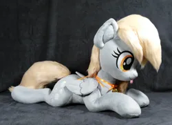 Size: 3048x2212 | Tagged: safe, artist:doctorkoda, derpibooru import, derpy hooves, pegasus, pony, :p, female, folded wings, image, irl, jpeg, lying down, mare, photo, plushie, prone, solo, tongue out, wings