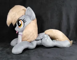 Size: 3476x2708 | Tagged: safe, artist:doctorkoda, derpibooru import, derpy hooves, pegasus, pony, :p, female, folded wings, image, irl, jpeg, lying down, mare, photo, plushie, prone, solo, tongue out, wings
