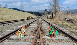 Size: 2048x1200 | Tagged: safe, derpibooru import, photographer:pakapaka1993, autumn blaze, cinder glow, summer flare, kirin, image, irl, japan, jpeg, photo, plushie, train tracks