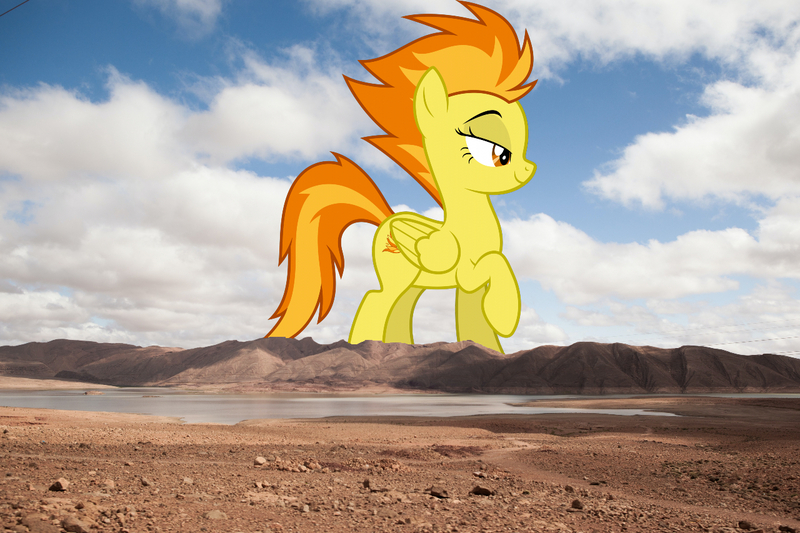 Size: 1280x853 | Tagged: safe, artist:dashiesparkle, derpibooru import, edit, editor:jaredking779, spitfire, pegasus, pony, bedroom eyes, female, folded wings, giant pony, giantess, highrise ponies, image, irl, jpeg, lidded eyes, macro, mare, mountain, mountain range, photo, ponies in real life, raised hoof, sexy, solo, stupid sexy spitfire, wings