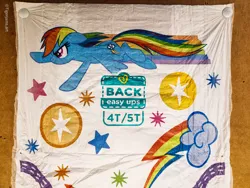 Size: 4000x3000 | Tagged: safe, derpibooru import, rainbow dash, diaper, flying, image, irl, jpeg, merchandise, pampers, photo, rainbow trail, simple background, solo