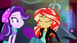 Size: 3072x1727 | Tagged: safe, derpibooru import, screencap, starlight glimmer, sunset shimmer, human, equestria girls, mirror magic, spoiler:eqg specials, beanie, canterlot mall, cinema, clothes, duo, duo female, eyes closed, female, frown, geode of empathy, hat, image, jacket, jewelry, leather, leather jacket, magical geodes, necklace, png