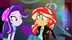 Size: 3072x1727 | Tagged: safe, derpibooru import, screencap, starlight glimmer, sunset shimmer, human, equestria girls, mirror magic, spoiler:eqg specials, beanie, canterlot mall, cinema, clothes, duo, duo female, female, frown, geode of empathy, hat, image, jacket, jewelry, leather, leather jacket, looking at each other, looking at someone, magical geodes, necklace, png