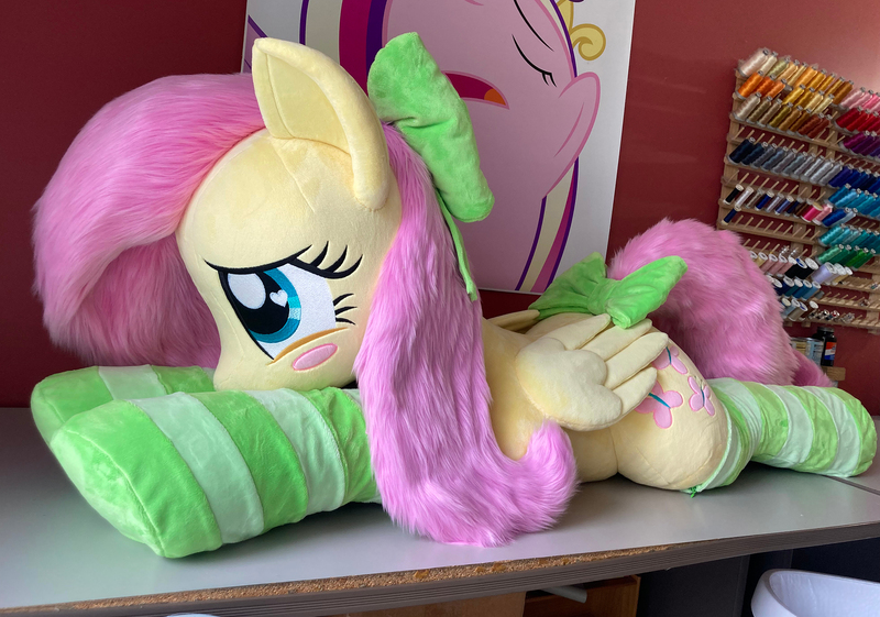 Size: 2363x1658 | Tagged: safe, artist:qtpony, derpibooru import, fluttershy, pony, clothes, image, irl, jpeg, lying down, photo, plushie, prone, socks, solo