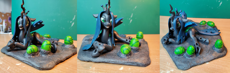 Size: 6000x1920 | Tagged: safe, artist:neo glin, derpibooru import, queen chrysalis, changeling, changeling queen, craft, egg, female, figurine, image, photo, png, sculpture, smiling, solo, wings