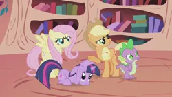 Size: 1920x1080 | Tagged: safe, derpibooru import, screencap, applejack, fluttershy, spike, twilight sparkle, dragon, earth pony, pegasus, unicorn, the ticket master, golden oaks library, image, indoors, library, looking offscreen, png, scary, serious, unicorn twilight