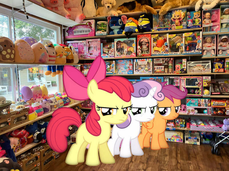 Size: 1032x774 | Tagged: safe, edit, editor:undeadponysoldier, photographer:undeadponysoldier, ponerpics import, ponybooru import, apple bloom, scootaloo, sweetie belle, earth pony, pegasus, pony, unicorn, angry, apple bloom is not amused, bow, cutie mark crusaders, female, filly, foal, gift shop, hair bow, image, irl, jpeg, looking at you, merchandise, minions, photo, plushie, ponies in real life, scootaloo is not amused, sweetie belle is not amused, toy, unamused