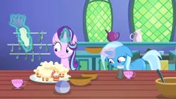 Size: 1920x1080 | Tagged: safe, derpibooru import, screencap, starlight glimmer, trixie, pony, all bottled up, cup, cupcake, female, floppy ears, food, glow, glowing horn, horn, icing bag, image, kitchen, magic, mare, pepper shaker, png, teacakes, teacup