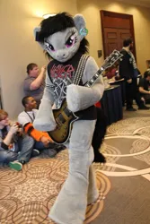 Size: 853x1280 | Tagged: dead source, safe, artist:atalonthedeer, derpibooru import, octavia melody, anthro, human, pony, 2015, clothes, convention, ear tag, electric guitar, fursuit, g4, guitar, image, irl, irl human, jpeg, looking at you, metalhead, musical instrument, photo, ponysuit, shirt, slayer, solo, strap