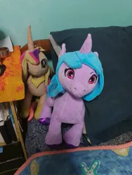 Size: 3000x4000 | Tagged: safe, derpibooru import, izzy moonbow, princess cadance, original species, plush pony, pony, g5, my little pony: a new generation, bed, image, irl, jpeg, photo, plushie, toy