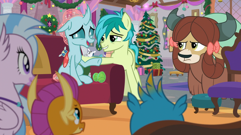 Size: 1920x1080 | Tagged: safe, derpibooru import, edit, edited screencap, screencap, gallus, ocellus, sandbar, silverstream, smolder, yona, changedling, changeling, changeling larva, dragon, earth pony, gryphon, hippogriff, pony, yak, the hearth's warming club, armchair, chair, changeling egg, christmas, christmas tree, dragoness, female, g4, holiday, image, jewelry, male, necklace, ocelbar, offspring, parents:ocelbar, png, shipping, straight, tree