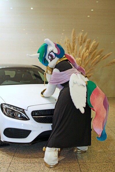 Size: 600x900 | Tagged: safe, artist:toki, derpibooru import, princess celestia, 2017, butt wings, car, clothes, dress, fursuit, image, indoors, irl, jewelry, jpeg, photo, ponysuit, rear view, regalia, solo, wings