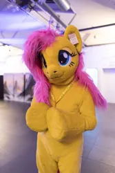 Size: 600x900 | Tagged: safe, artist:atalonthedeer, derpibooru import, fluttershy, pony, 2022, eurofurence, fursuit, image, irl, jpeg, photo, ponysuit, solo