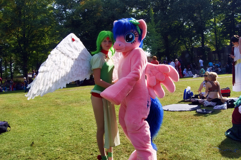 Size: 1920x1278 | Tagged: safe, artist:atalonthedeer, derpibooru import, firefly, human, g1, 2012, connichi, duo focus, fursuit, grass, image, irl, irl human, jpeg, outdoors, photo, ponysuit, solo