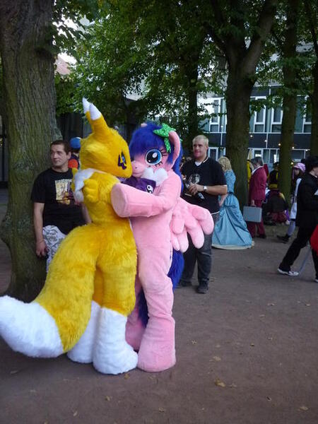 Size: 480x640 | Tagged: safe, artist:atalonthedeer, derpibooru import, firefly, human, g1, 2012, connichi, duo focus, fursuit, image, irl, irl human, jpeg, outdoors, photo, pokémon, ponysuit, solo