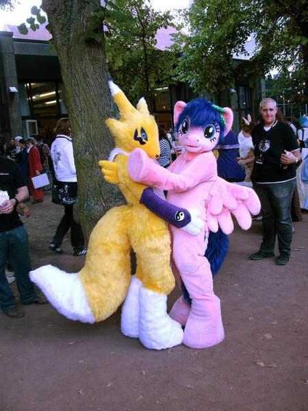 Size: 480x640 | Tagged: safe, artist:atalonthedeer, derpibooru import, firefly, human, g1, 2012, connichi, duo focus, fursuit, image, irl, irl human, jpeg, outdoors, photo, pokémon, ponysuit