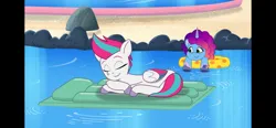 Size: 2532x1170 | Tagged: safe, derpibooru import, screencap, zipp storm, pegasus, pony, unicorn, g5, my little pony: tell your tale, spoiler:g5, spoiler:my little pony: tell your tale, spoiler:tyts02e23, adorazipp, cute, duo, duo female, eyes closed, female, floaty, horn, image, mare, misty brightdawn, nap, png, pool toy, sleeping, swimming pool, the water park