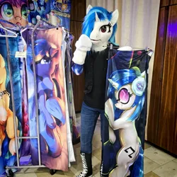 Size: 2475x2475 | Tagged: safe, artist:essorille, artist:vinylpone, derpibooru import, vinyl scratch, anthro, human, pony, unicorn, g4, animal costume, arm hooves, blue mane, body pillow, clothes, convention, cosplay, costume, cute, czequestria, dakimakura cover, equine, female, furry, fursuit, hooves, horn, image, indoors, irl, irl human, jpeg, mare, messy mane, photo, ponysuit, posing for photo, public, purple eyes, ruffled hair, shirt, solo, surprised