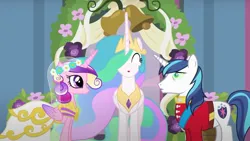 Size: 2140x1205 | Tagged: safe, derpibooru import, screencap, princess cadance, princess celestia, queen chrysalis, shining armor, alicorn, changeling, pony, unicorn, a canterlot wedding, g4, season 2, bride, canterlot castle, clothes, disguise, disguised changeling, dress, eyes closed, fake cadance, force field, gown, groom, happy, horn, image, jpeg, marriage, royal wedding, sash, uniform, wedding, wedding dress