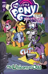 Size: 2063x3131 | Tagged: safe, artist:andy price, artist:andypriceart, derpibooru import, idw, official, applejack, pinkie pie, rarity, spike, bird, crow, dragon, earth pony, pony, unicorn, g4, spoiler:comic, and then there's rarity, applejack is not amused, applejack's hat, axe, beret, bipedal, camera, clothes, comic cover, cover, cover art, cowboy hat, cut, director, dorothy gale, female, freckles, hat, high res, horn, image, male, mare, marshmelodrama, megaphone, movie, my little pony classics reimagined: the unicorn of odd, my little pony logo, nick chopper, official comic, overalls, png, rarity being rarity, scarecrow, set, smiling, speech bubble, the scarecrow, the unicorn of odd, the wizard of oz, tin, tin man, tin pony, tin woodsman, tongue out, tree stump, unamused, weapon, yelling, yellow brick road