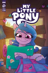 Size: 2063x3131 | Tagged: safe, artist:robin easter, derpibooru import, idw, official, izzy moonbow, pony, unicorn, g5, spoiler:comic, spoiler:g5, spoiler:g5comic, spoiler:g5comic015, spoiler:g5comic15, blanket, coat markings, comic cover, cover, cover art, female, googly eyes, high res, horn, image, mare, my little pony logo, official comic, png, scissors, sewing, sewing machine, signature, solo