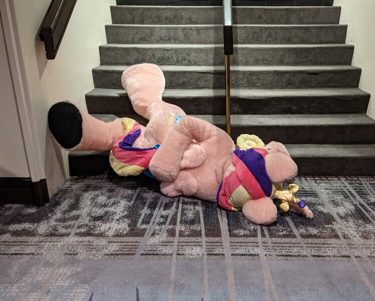 Size: 2048x1643 | Tagged: safe, artist:qtpony, artist:zizzydizzymc, derpibooru import, princess cadance, g4, family guy death pose, female, fursuit, image, irl, jpeg, on ground, photo, ponysuit, solo, stairs