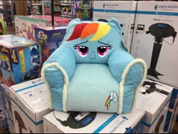 Size: 1170x883 | Tagged: safe, derpibooru import, rainbow dash, g4, armchair, chair, image, irl, jpeg, lidded eyes, merchandise, photo, smiling