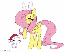 Size: 1280x1050 | Tagged: safe, artist:mellanholia, derpibooru import, angel bunny, fluttershy, pegasus, pony, rabbit, angel bunny is not amused, animal, blushing, bunny ears, christmas, ear fluff, hat, holiday, image, jpeg, raised hoof, santa hat, simple background, smiling, unamused, white background