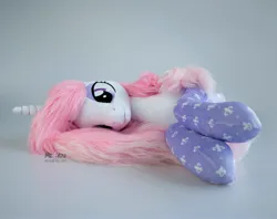 Size: 1894x1500 | Tagged: safe, artist:meplushyou, derpibooru import, fleur-de-lis, pony, g4, clothes, image, irl, jpeg, lying down, photo, plushie, prone, socks, solo