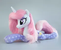 Size: 1834x1500 | Tagged: safe, artist:meplushyou, derpibooru import, fleur-de-lis, pony, g4, clothes, image, irl, jpeg, lying down, photo, plushie, prone, socks, solo