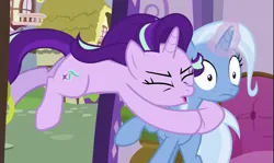 Size: 893x531 | Tagged: safe, derpibooru import, screencap, starlight glimmer, trixie, pony, unicorn, all bottled up, g4, building, cropped, doorway, duo, eyes closed, frown, glomp, glow, glowing horn, horn, image, indoors, my little pony, open door, png, ponyville, shrunken pupils, tackle