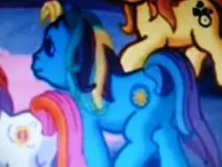 Size: 600x450 | Tagged: safe, derpibooru import, screencap, bumblesweet, seaspray, sunny daze (g3), earth pony, g3, g4, positively pink, blue pony, cropped, image, jpeg, multicolored mane, multicolored tail, offscreen character, photo, picture of a screen, solo focus, tail, walking