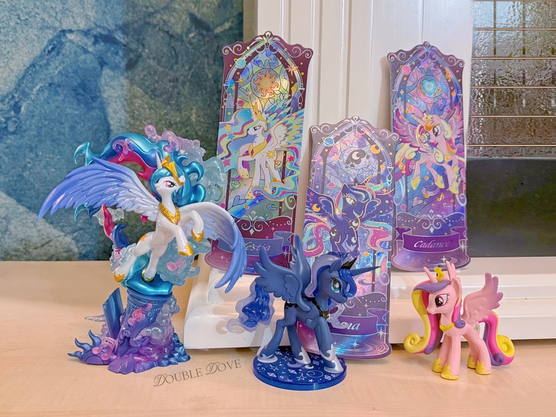 Size: 4380x3285 | Tagged: safe, derpibooru import, kotobukiya, official, princess cadance, princess celestia, princess luna, pony, g4, belly, concave belly, figure, funko, image, irl, jpeg, kayou, large wings, merchandise, music notes, photo, rainbow power, rainbow power-ified, raised hoof, search fun, side view, slender, spread wings, statue, thin, ticket, toy, wings