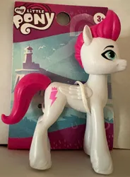 Size: 2559x3478 | Tagged: safe, derpibooru import, zipp storm, g5, concave belly, image, irl, jpeg, merchandise, my little pony logo, photo, picture, slender, solo, thin, toy, unshorn fetlocks, zipp is skinny, zipp is tall