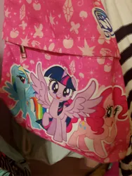 Size: 3120x4160 | Tagged: safe, derpibooru import, official, pinkie pie, rainbow dash, twilight sparkle, twilight sparkle (alicorn), alicorn, butterfly, earth pony, insect, pegasus, pony, g4, apple, balloon, diamond, food, horn, image, irl, jpeg, laughing, logo, looking at you, merchandise, my little pony logo, open mouth, open smile, photo, rainbow dash's cutie mark, raised hoof, smiling, smiling at you, smirk, spread wings, standing, stars, twilight sparkle's cutie mark, walking, wings, zipper