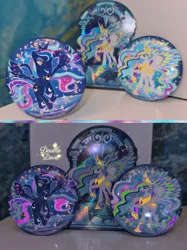 Size: 3442x4590 | Tagged: safe, derpibooru import, official, princess celestia, princess luna, g4, badge, card, crystal, glow-in-the-dark, image, irl, jpeg, merchandise, photo, rainbow power, rainbow power-ified, raised hoof, spread wings, stained glass, wings