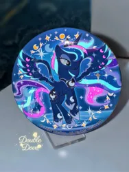 Size: 1752x2336 | Tagged: safe, derpibooru import, official, princess luna, g4, badge, glow-in-the-dark, image, irl, jpeg, merchandise, moon, photo, rainbow power, rainbow power-ified, raised hoof, spread wings, stars, transparent mane, wings