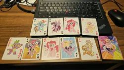 Size: 4000x2252 | Tagged: safe, derpibooru import, official, applejack, fluttershy, pinkie pie, rainbow dash, rarity, spike, twilight sparkle, twilight sparkle (alicorn), alicorn, dragon, earth pony, pegasus, pony, unicorn, g4, ace of clubs, ace of diamonds, ace of hearts, ace of spades, female, flying, horn, image, jpeg, mane six, mare, merchandise, photo, playing card, stock vector