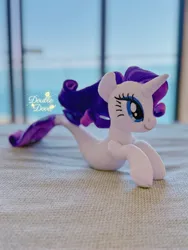 Size: 3024x4032 | Tagged: safe, derpibooru import, rarity, seapony (g4), unicorn, g4, bedroom, horn, image, indoors, irl, jpeg, ocean, photo, plushie, pony plushie, seaponified, seapony rarity, side view, solo, species swap, water