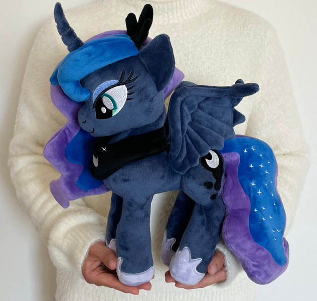 Size: 1000x950 | Tagged: safe, derpibooru import, princess luna, alicorn, human, pony, g4, female, image, irl, irl human, jpeg, mare, photo, plushie, solo, symbiote studios