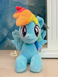 Size: 2694x3592 | Tagged: safe, derpibooru import, official, rainbow dash, pegasus, pony, g4, front view, image, irl, jpeg, looking at you, lying down, merchandise, photo, plushie, pony plushie, reesee, smiling, solo, spread wings, wings