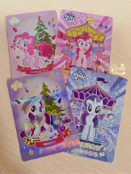 Size: 3955x5273 | Tagged: safe, derpibooru import, official, pinkie pie, rarity, earth pony, pony, unicorn, g4, candy, candy cane, card, carousel, christmas, christmas tree, clothes, cutie mark, food, front view, holiday, horn, image, irl, jpeg, looking at you, looking back, looking offscreen, merchandise, photo, present, side view, tree, walking, winter outfit