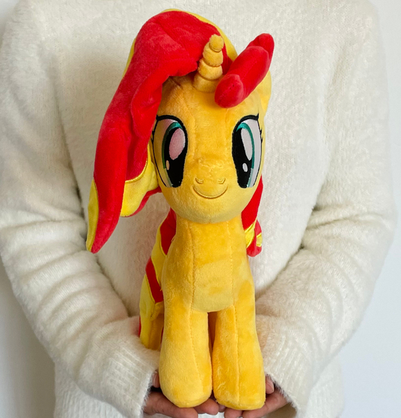 Size: 1000x1044 | Tagged: safe, derpibooru import, sunset shimmer, human, pony, unicorn, g4, female, horn, image, irl, irl human, jpeg, looking at you, mare, merchandise, photo, plushie, solo, symbiote studios